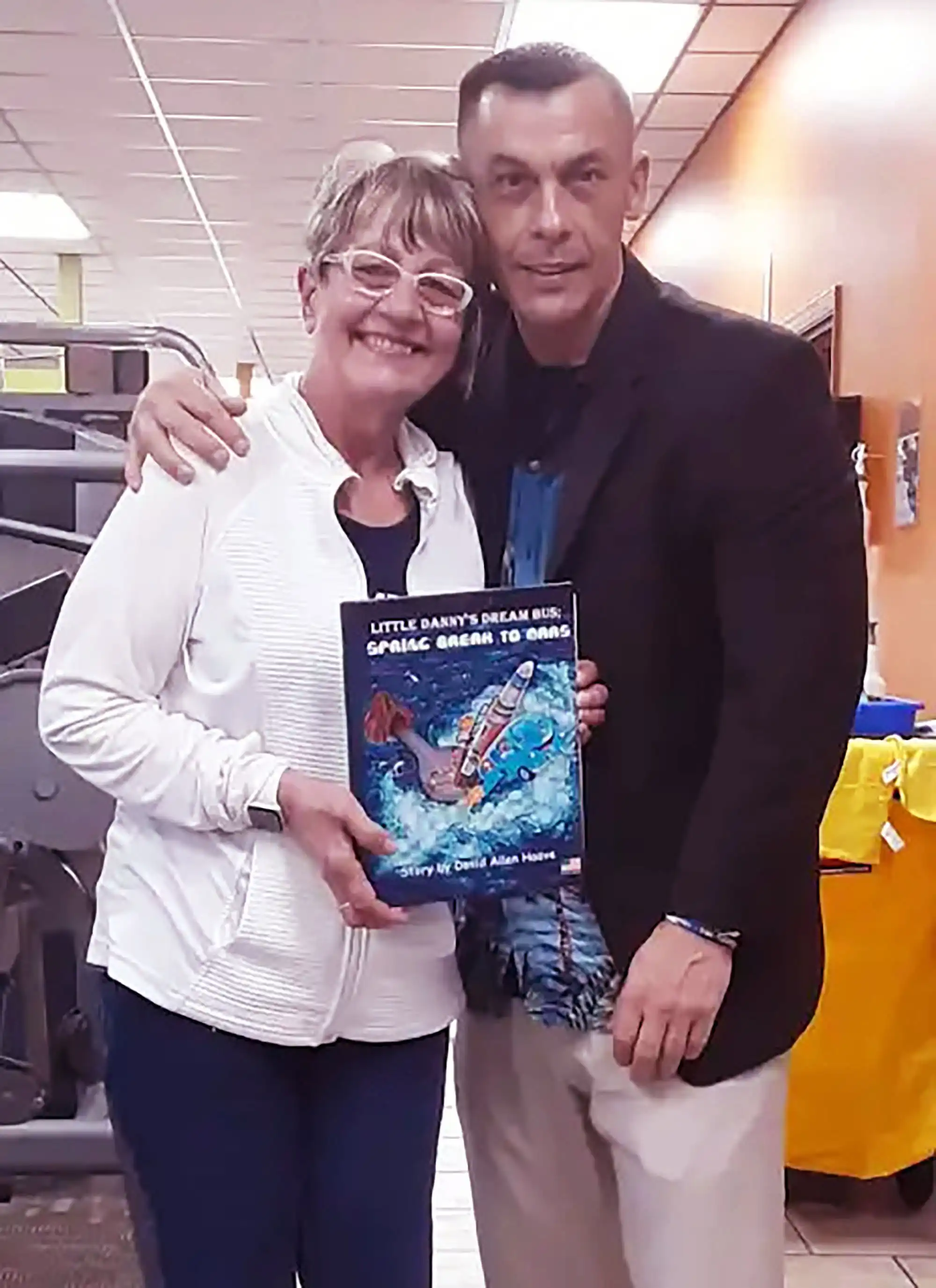 Signing books for a local Gym, author David Haave promotes his books for the parents and how important reading is for kids growing with good educations. -- David Haave